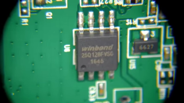 A magnified view clearly showing the Winbond 25Q128FV flash memory chip.