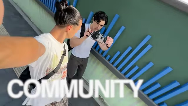 Text "COMMUNITY" shown over a video clip.
