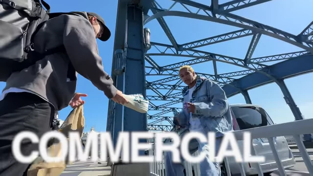 Text "COMMERCIAL" shown over a video clip.
