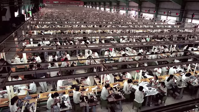 Factory floor with numerous workers