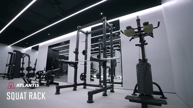 The Atlantis Squat Rack, equipped with barbells and weight plates.