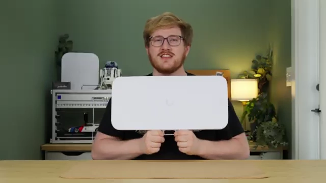 The presenter holding the E7 Audience, demonstrating its significant size.