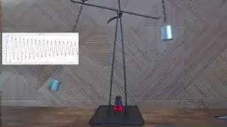 A simple pendulum setup, illustrating how the length of the pendulum affects its oscillation frequency and dampening.