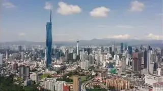 An aerial view of Kuala Lumpur's modern skyline with a prominent skyscraper, representing a chosen base in Southeast Asia