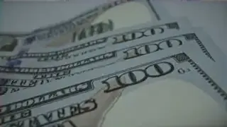 Stacks of hundred-dollar bills, representing the substantial financial costs of undoing inefficient business structures