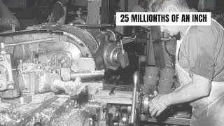 Factory worker adjusts machinery to precise measurements