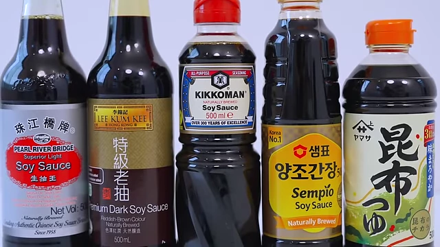 Various brands of soy sauce bottles, highlighting different types and origins.