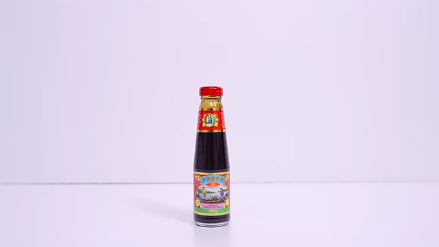 A bottle of Lee Kum Kee Premium Oyster Sauce.