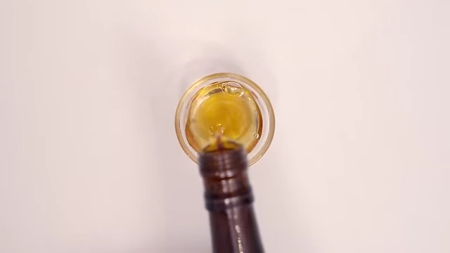 Shaoxing wine being poured into a small glass.