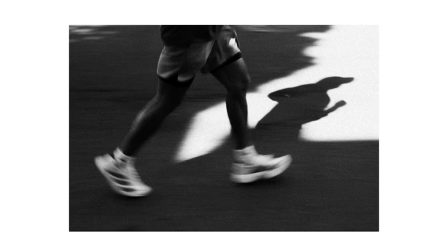 A cropped photo showing a runner with strong shadows, creating a balanced composition.