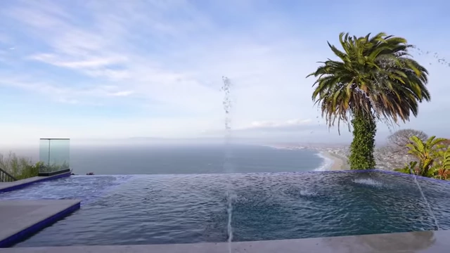 An infinity pool with ocean views at a luxury mansion
