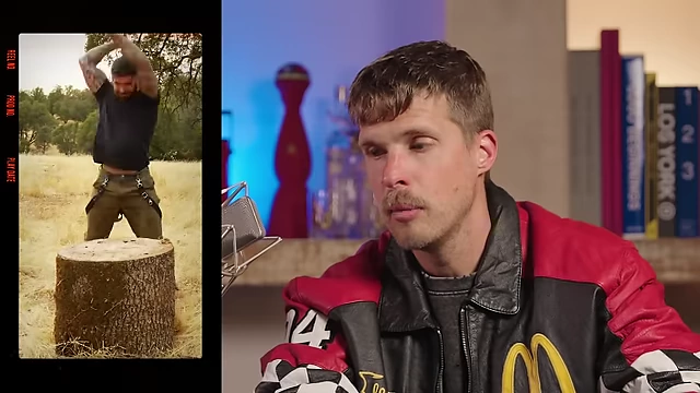 A creator chopping wood while speaking to the camera.