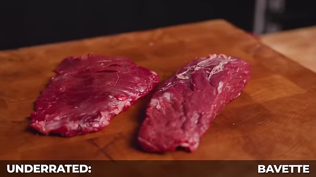 A raw bavette steak, similar to flank steak but often thicker with better marbling, labeled as "Underrated: Bavette."