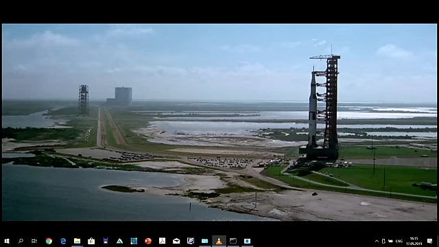 The immense scale of the Apollo 11 mission, showing the Saturn V rocket on its crawler transporter