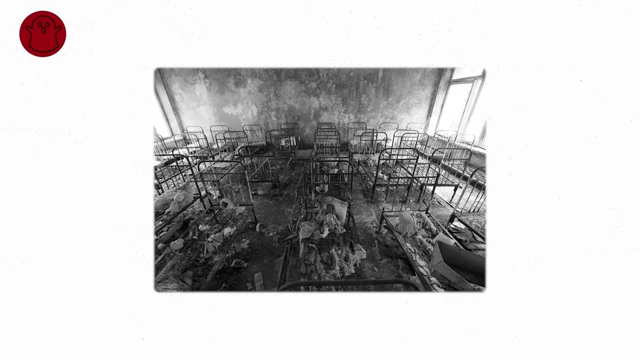 Abandoned bunk beds in a dilapidated room, possibly from Pripyat