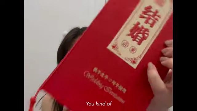 A detailed red wedding invitation card.