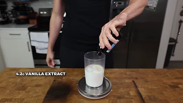 Adding 4.2g of vanilla extract.