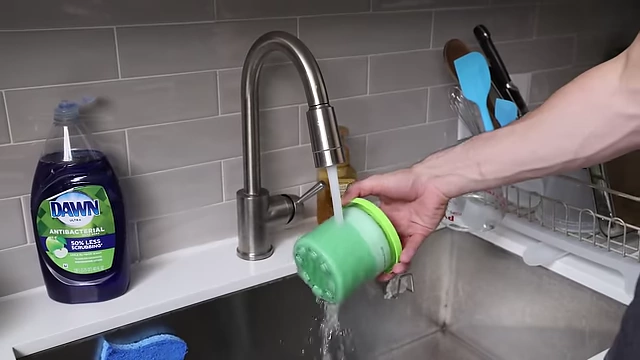 Rinsing the frozen pint under hot water for 1 minute before CREAMi processing.
