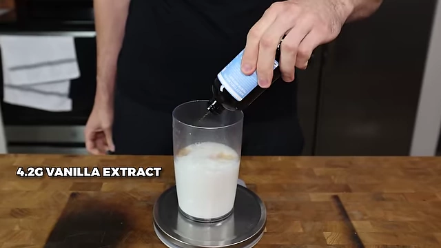 Adding 4.2g of vanilla extract to the Oreo ice cream base.