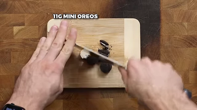 Chopping additional mini Oreos for layering and topping.