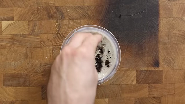 Adding a second layer of chopped Oreos for consistent crunch throughout the pint.