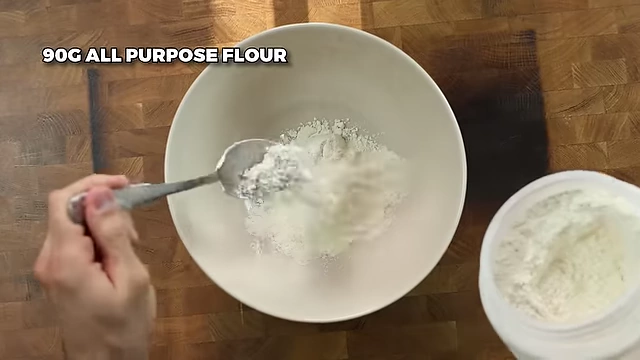 Adding 90g of all-purpose flour for the cookie dough.