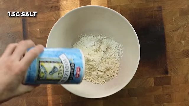 Adding 1.5g of salt to the dry ingredients for the cookie dough.