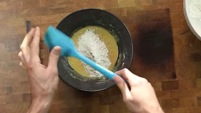 Switching to a rubber spatula as the cookie dough thickens.