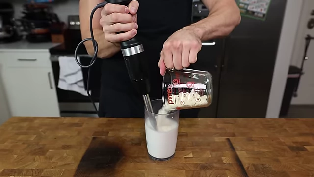 Slowly blending dry ingredients into the wet ingredients for the cookie dough ice cream base.