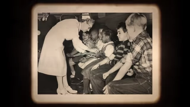 A nurse administering a vaccine to a child in a historical setting.