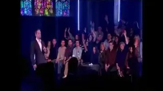 Darren Brown on stage with an audience, demonstrating how suggestion can influence sensory perception.