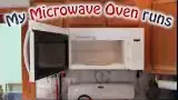 Microwave oven with door open and warning text