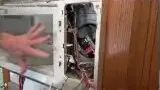 Internal view of microwave showing wires and switches