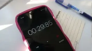 A phone displaying a stopwatch timer at 29 minutes and 85 seconds.