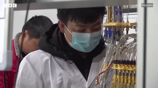 Chinese experts working in a lab, reflecting the talent brought back through programs like the Thousand Talents Plan