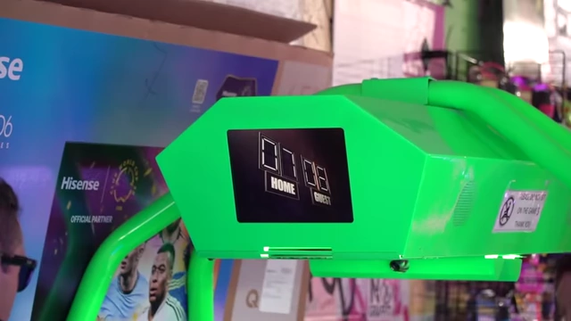 An air hockey scoreboard displaying "HOME 07 GUEST 06"