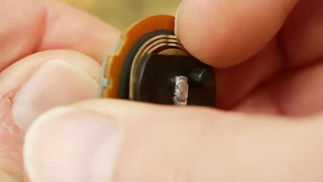 A close-up of a potentiometer's internal wiper, illustrating a common application for finely etched metal parts.