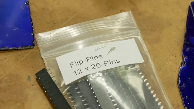 A bag labeled "Flip-Pins", showcasing a niche product that benefits from photochemical etching due to low production volume needs.