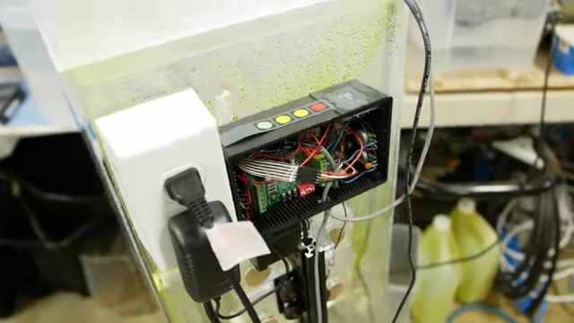 A close-up of the control box for the linear belt drive actuator, showing the stepper motor driver and Teensy microcontroller for automated etching.
