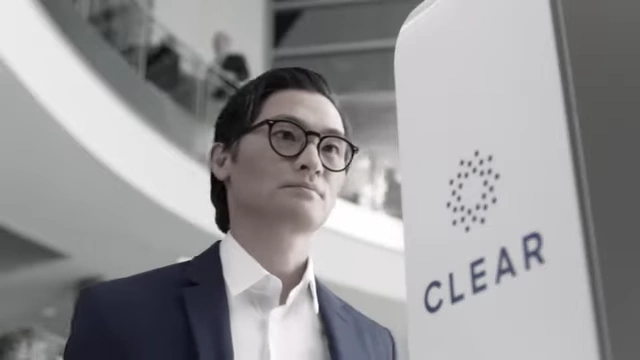 A traveler using the CLEAR biometric check-in at an airport