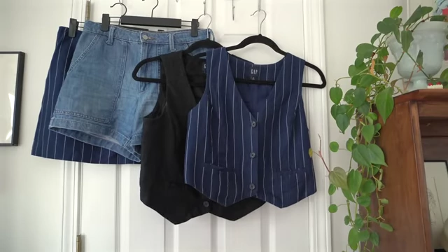 Clothing items the speaker regretted packing: V-neck vests, a striped skirt, and denim shorts