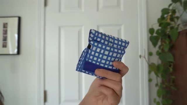 Compact, folded Shupato bag demonstrates its small size for easy packing