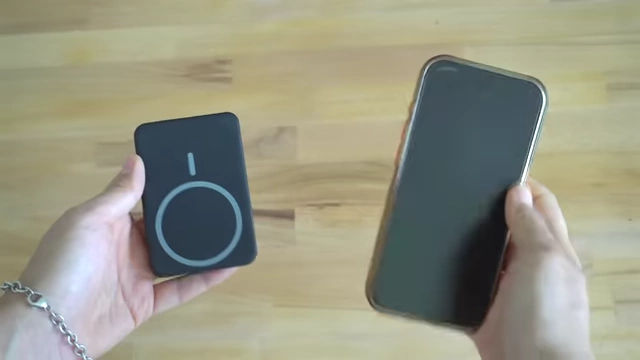 Portable charger magnetically attaching to a phone for on-the-go power