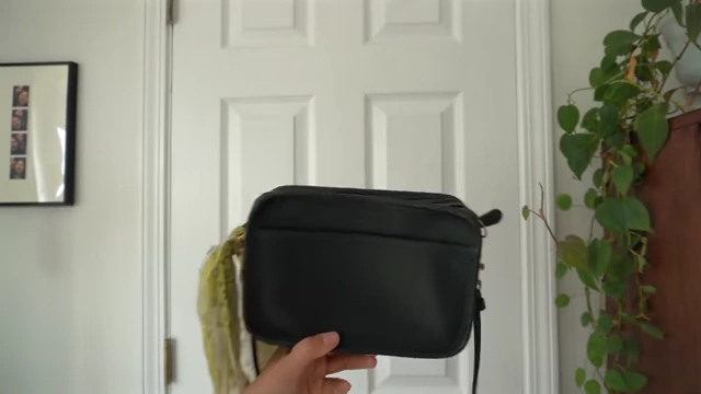 A small black purse, found to be less practical for daily use