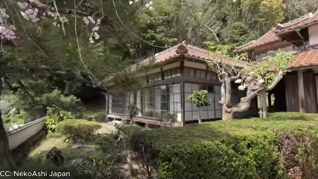 An exterior shot of an old, but relatively well-preserved Akiya home.