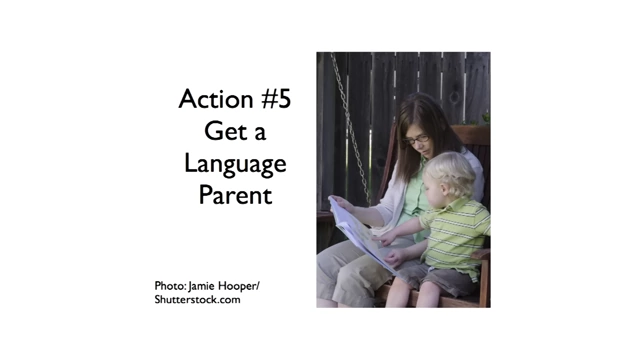 A mother reading to her child, illustrating the concept of a language parent