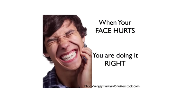 A person clenching their teeth in pain, illustrating the soreness one might feel when practicing new facial muscle movements for language acquisition