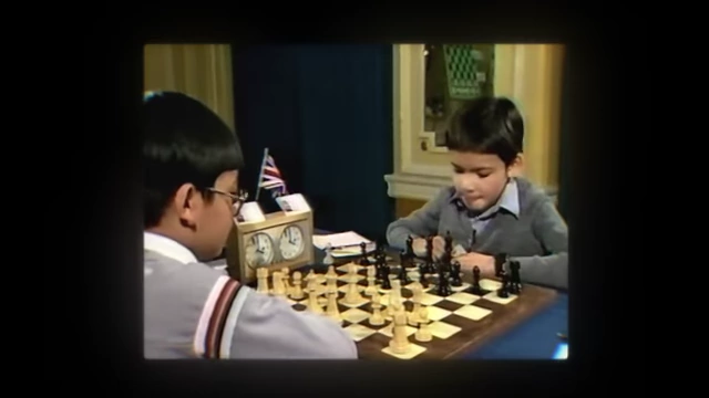 A young Demis Hassabis playing chess, showcasing his early intellectual aptitude