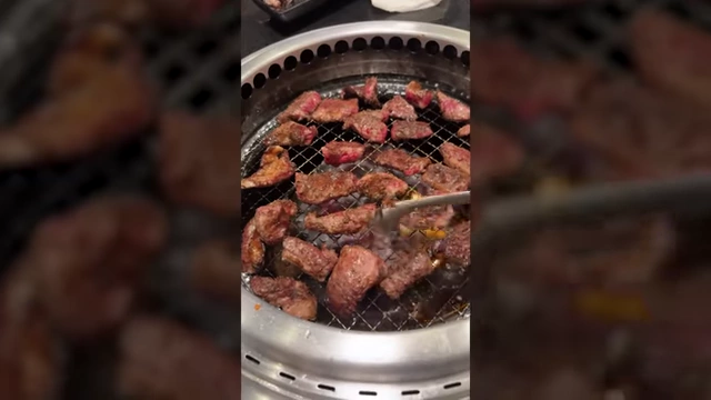 Meat grilling at a restaurant, an example of the buffet-style eating Max enjoyed