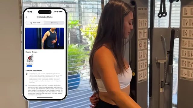 Isabel performing a cable lateral raise, with an overlay of the Built with Science Plus app providing exercise guidance
